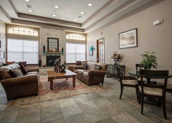 a living room filled with furniture and a fire place